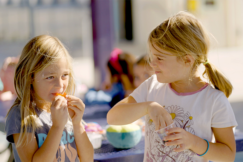 students eat fruit